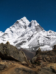 Night shot of summit Ama Dablam with stars in sky in Nepal