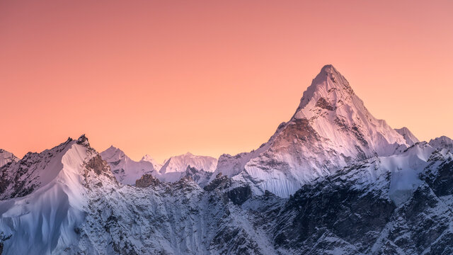 Panoramic view to summit Ama Dablam and snow peaks with beautiful light after sunset in Nepal - Powered by Adobe