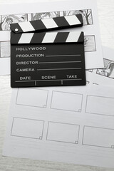 Storyboard and clapperboard on the director's desk. Planned scenes for the film.