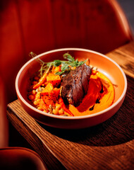 Baked pumpkin with meat and vegetables.