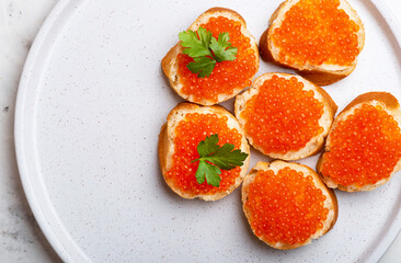 Sandwiches with red caviar top view copy space