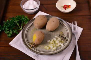 Boiled potatoes with vegetable oil and onions.