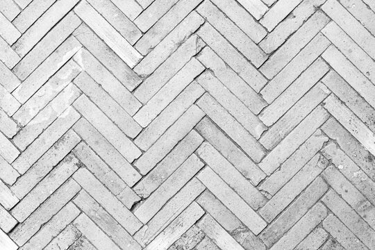 White cement block floor tile with triangular pattern and background seamless
