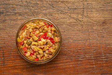 side dish bowl of olive bruschetta on a rustic weathered wood, Mediterranean cuisine