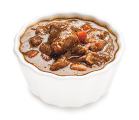 Bowl with tasty beef curry on white background