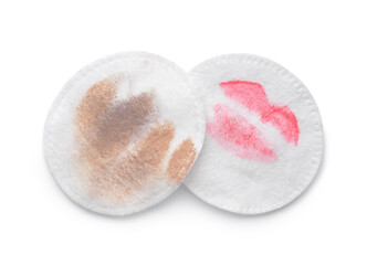 Dirty cotton pads after removing makeup on white background