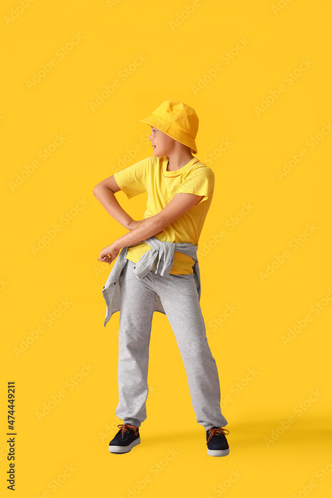 Poster Dancing little boy on color background