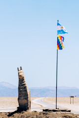 flag and llama statue
