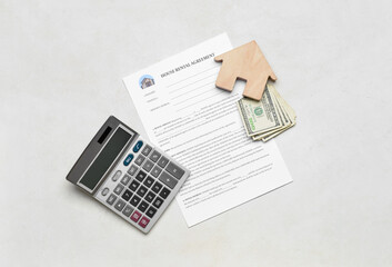 House rental agreement with wooden toy, banknotes and calculator on light background