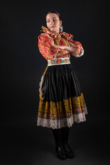 Young beautiful slovak woman in traditional dress. Slovak folklore
