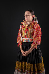 Young beautiful slovak woman in traditional dress. Slovak folklore