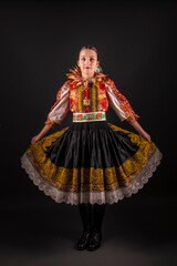 Young beautiful slovak woman in traditional dress. Slovak folklore