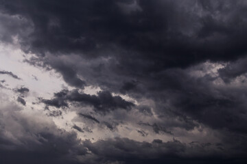 Naklejka na ściany i meble Epic Storm sky with dark cumulus clouds abstract background texture, thunderstorm