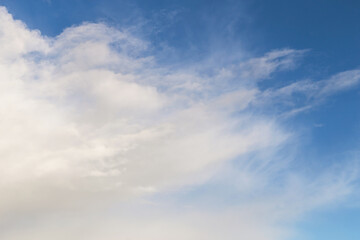 Abstract background clouds texture. Blue sky with white cirrus clouds