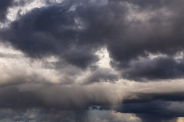 Obraz na płótnie Canvas Epic Dramatic Storm sky with dark grey cumulus rainy clouds background texture, thunderstorm