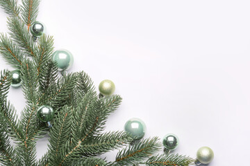 Fototapeta na wymiar Christmas branches with balls on white background