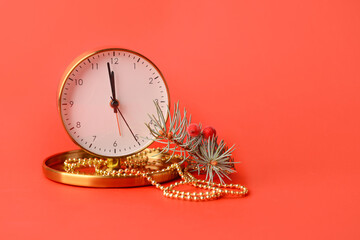 Christmas composition with alarm clock on color background