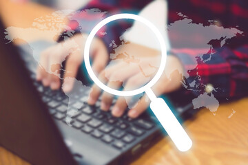blurred Businessman use laptop for search with search engine icon magnifying glass globe.Searching...