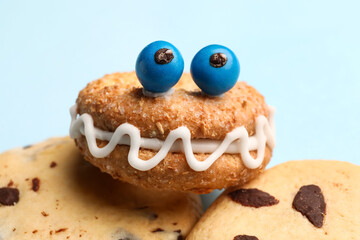 Funny cookies on light background, closeup