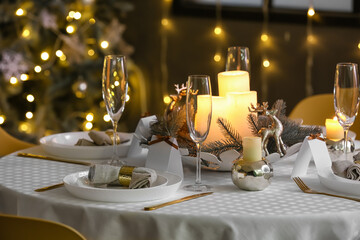 Dining table with setting for Christmas celebration indoors