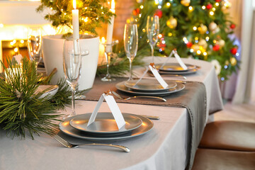 Dining table with beautiful setting in living room decorated for Christmas eve