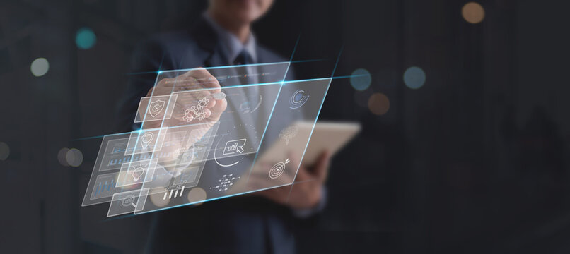 Data scientists. Man programmer using digital tablet analyzing development and processing data, information on futuristic virtual interface screen