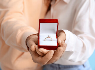 Young couple with engagement ring, closeup