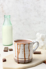 Cup of natural hot chocolate on white background