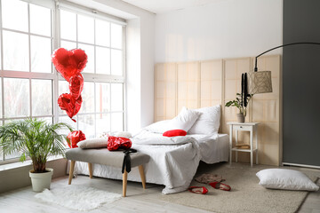 Interior of messy bedroom after romantic date