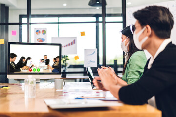 Group of professional asian business meeting and discussing strategy with new startup project.Creative business people video conference online meeting with business colleagues team in modern office