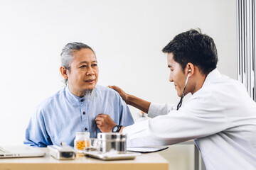 Obraz premium Asian man doctor service help support discussing and consulting talk to asian senior man patient at meeting health medical care express trust concept in hospital.healthcare and medicine