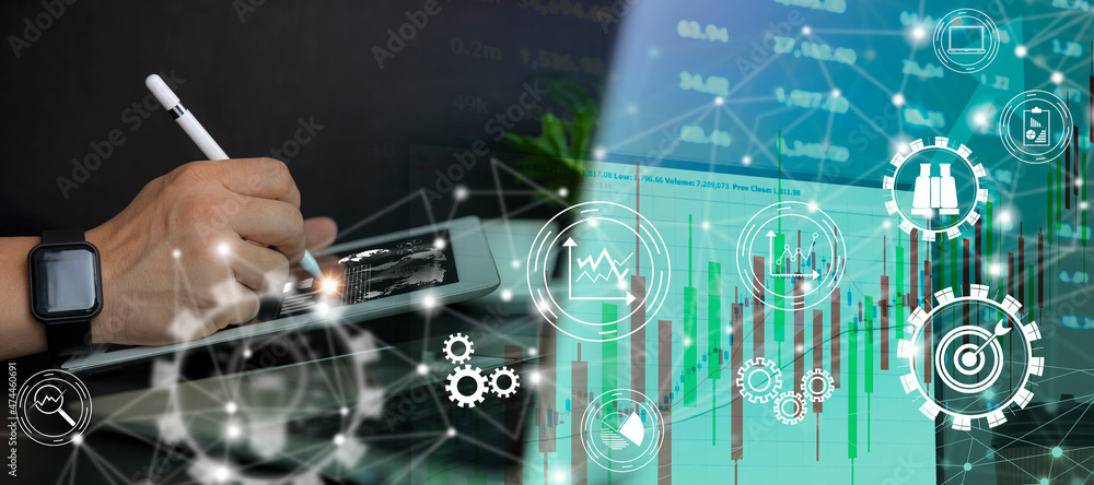 Poster a close-up analysis of the young businessman points to the data presented in a chart with a pen whil