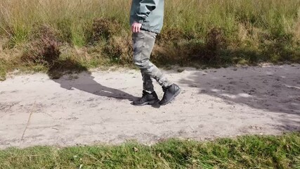 Shot of a guy walking forth and back.