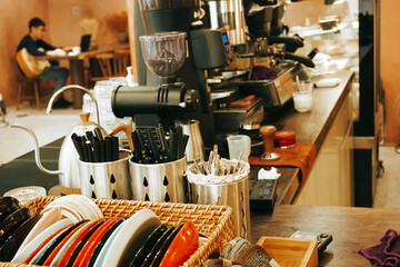 The vintage cafe bar restaurant indoor. Empty coffee shop interior daytime with a rustic counter orange wall in the background. 