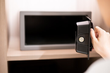 Unrecognizable Asian businesswoman opening a safe box or vault storage. 
