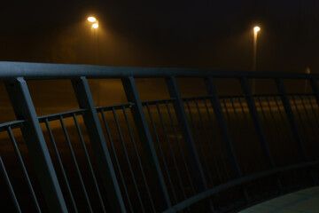 street lights under a concrete bridge in the fog in the city of Prague at night 2021