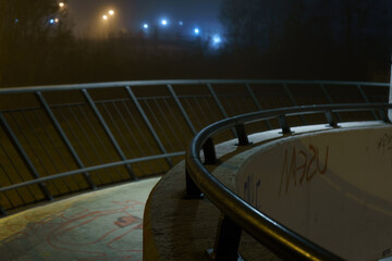 street lights under a concrete bridge in the fog in the city of Prague at night 2021