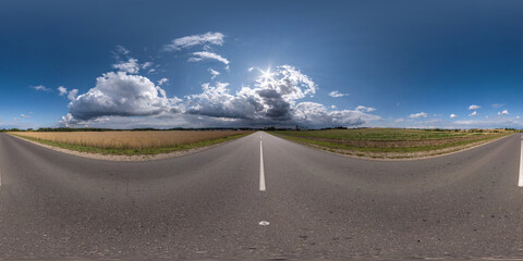 full seamless spherical hdri 360 panorama on old no traffic asphalt road among fields before storm in equirectangular projection, ready for VR AR virtual reality © hiv360