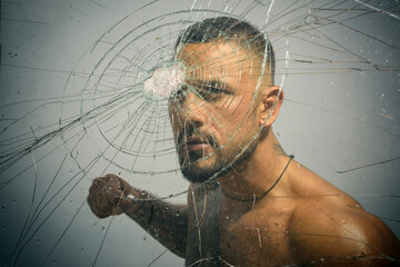 Gangster man, cracked glass. Ready to fight. Man boxing, strength and power. Hispanic gang man, south american latin, criminal guy with serious face.