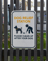 Pet relief area sign at the city. Dog relief station on the street of a city.