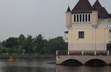 castle on the river in the rain