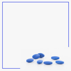 Obraz na płótnie Canvas Blue pills, medicine isolated on white background with blue frame