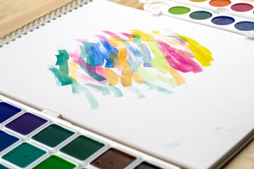 watercolor paints sketchbook with samples of paints