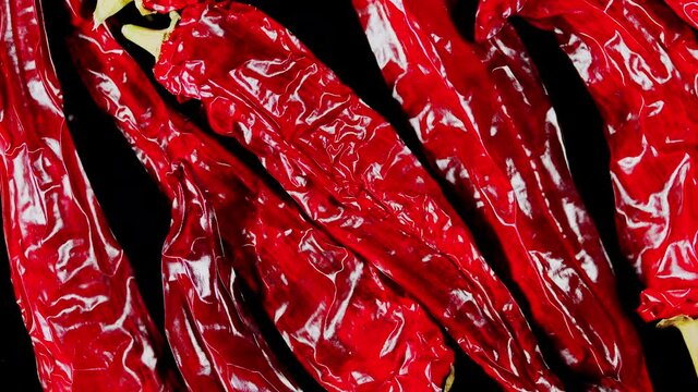 Red chili peppers on a dark background. Red pepper harvest.