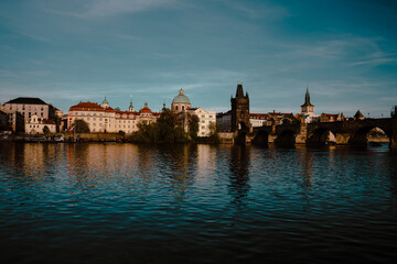 Panoramic view of Charles Bridge on the Vltava river in the center of Prague on a sunny day 2021 during storm