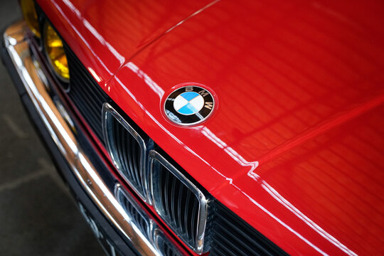BMW logo brand sign on old timer vintage retro front car hood face