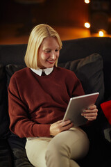 Woman using digital tablet at home