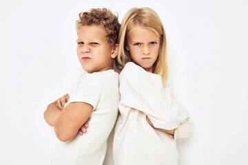 Two children boy and girl little cheerful cheery friends lifestyle Studio