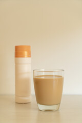 coffee latte glass with ready to drink coffee bottles