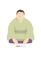 扇子を前に置いてお辞儀をしている着物を着た男性噺家